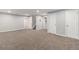 Spacious carpeted basement area with multiple doors, offering flexible use at 8065 Clay St, Westminster, CO 80031