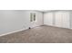 Finished basement with carpet, window, and double door closet at 8065 Clay St, Westminster, CO 80031