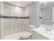 Sleek bathroom featuring white tile shower, modern fixtures, and recessed lighting at 8065 Clay St, Westminster, CO 80031