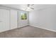 This carpeted bedroom has a ceiling fan, a window, and a double door closet at 8065 Clay St, Westminster, CO 80031