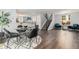 Open concept dining area featuring modern decor, hardwood floors, and seamless access to living spaces at 8065 Clay St, Westminster, CO 80031