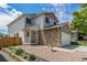 Attractive two-story home with stone accents, manicured landscaping, and a welcoming entrance at 8065 Clay St, Westminster, CO 80031