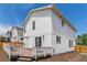Exterior shows white siding, complemented by a wood fence surrounding a wooden deck and mulched yard at 8065 Clay St, Westminster, CO 80031