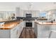 Stylish kitchen featuring butcher block countertops, gray cabinets, black backsplash and stainless steel appliances at 8065 Clay St, Westminster, CO 80031
