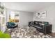 Bright living room featuring contemporary furnishings, patterned rug and lots of natural light at 8065 Clay St, Westminster, CO 80031
