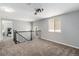 Upstairs landing with natural light, access to bedroom, and modern railing at 8065 Clay St, Westminster, CO 80031