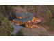 Aerial view of home featuring an expansive deck perfect for entertaining and outdoor living at 394 S Ponderosa Way, Evergreen, CO 80439