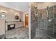 Spacious bathroom featuring double vanity, tile floors, and a tiled walk-in shower with a built-in bench at 394 S Ponderosa Way, Evergreen, CO 80439