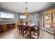Formal dining room featuring wood floors, natural light, and mountain views, perfect for gatherings at 394 S Ponderosa Way, Evergreen, CO 80439