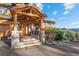 Charming front porch with stone columns and wood detailing creating an inviting entrance at 394 S Ponderosa Way, Evergreen, CO 80439