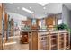 Open kitchen with granite countertops, a large island, skylights, and stone accents creates a warm and inviting space at 394 S Ponderosa Way, Evergreen, CO 80439