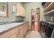 Well-equipped laundry room featuring a sink, ample counter space, and modern washer and dryer units at 394 S Ponderosa Way, Evergreen, CO 80439
