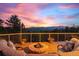 Outdoor fire pit with comfortable seating and stunning views, great for relaxing and entertaining at 394 S Ponderosa Way, Evergreen, CO 80439