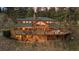 An expansive deck wraps around this home, offering multiple seating areas and breathtaking views of the surrounding landscape at 394 S Ponderosa Way, Evergreen, CO 80439