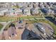 Stunning aerial view of a community park with playground equipment nestled between single-Gathering homes at 13986 Lexington Dr, Parker, CO 80134