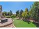 Backyard features artificial turf, rock garden and paver patio at 13986 Lexington Dr, Parker, CO 80134
