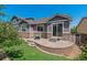 Backyard features stone patio and grassy area at 13986 Lexington Dr, Parker, CO 80134
