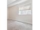 Basement room features neutral carpet and window for natural light at 13986 Lexington Dr, Parker, CO 80134