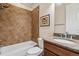 Bathroom features a tiled shower/tub combo and a granite vanity at 13986 Lexington Dr, Parker, CO 80134