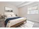 Bright bedroom with neutral tones, a white bed frame, and a modern style with comfortable bedding at 13986 Lexington Dr, Parker, CO 80134