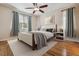 Bright bedroom with natural light, hardwood floors, and elegant curtains, creating a serene atmosphere at 13986 Lexington Dr, Parker, CO 80134