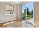 Bright bedroom features sliding glass door access to the yard at 13986 Lexington Dr, Parker, CO 80134