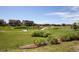 Expansive community green space with walking paths and manicured landscaping at 13986 Lexington Dr, Parker, CO 80134