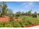 Beautiful community pool and lounge area surrounded by well-maintained landscaping and lush greenery at 13986 Lexington Dr, Parker, CO 80134