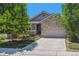 Charming two-story home with a stone facade, covered entry, two-car garage, and well-maintained lawn at 13986 Lexington Dr, Parker, CO 80134