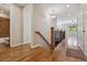 Hallway features wood floors, a staircase, and access to other rooms of the house at 13986 Lexington Dr, Parker, CO 80134