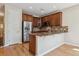 Stylish kitchen with stainless steel appliances, a breakfast bar, and ample cabinet space at 13986 Lexington Dr, Parker, CO 80134