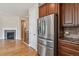 Modern kitchen with stainless steel appliances, granite countertops, and rich wood cabinetry at 13986 Lexington Dr, Parker, CO 80134