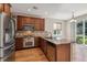 Well-equipped kitchen featuring stainless steel appliances, granite counters, and a cozy breakfast nook at 13986 Lexington Dr, Parker, CO 80134