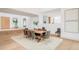 Chic dining space featuring hardwood floors, a spacious table with seating for eight, and modern artwork at 1 Sedgwick Dr, Cherry Hills Village, CO 80113