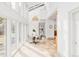 Airy dining room with large windows, pendant lighting, and light tile floors at 1 Sedgwick Dr, Cherry Hills Village, CO 80113