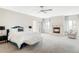 Inviting main bedroom featuring a fireplace, plush carpeting, and a comfortable bench at 1 Sedgwick Dr, Cherry Hills Village, CO 80113