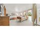 Spacious primary bedroom with multiple windows providing natural light and backyard views at 396 E Warren Ave, Denver, CO 80210