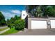 Modern home featuring a garage and lush greenery in a well-maintained neighborhood at 396 E Warren Ave, Denver, CO 80210