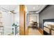 Bright hallway with natural light, modern railing, home office area and interesting architectural details at 396 E Warren Ave, Denver, CO 80210