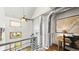 Hallway with soaring ceilings, lots of natural light, and a home office area at 396 E Warren Ave, Denver, CO 80210