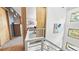 Hallway boasts modern railings, lots of natural light, and wood doors and trim at 396 E Warren Ave, Denver, CO 80210