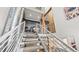 Modern staircase with unique industrial ductwork creating an open and airy feel at 396 E Warren Ave, Denver, CO 80210