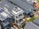 Aerial view of the home showing rooftop deck, multiple balconies and fenced backyard at 3540 Pecos St, Denver, CO 80211