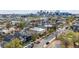 A dynamic neighborhood with various modern homes, a playground, and a cityscape backdrop create an urban oasis at 3540 Pecos St, Denver, CO 80211