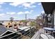 View from the balcony with bistro table, spiral staircase and city views at 3540 Pecos St, Denver, CO 80211