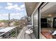 Relax on this balcony with a bistro set and wrought iron spiral staircase and city views at 3540 Pecos St, Denver, CO 80211