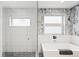 Modern bathroom featuring a glass enclosed walk-in shower and sleek fixtures at 3540 Pecos St, Denver, CO 80211