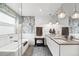 Bright bathroom with dual sinks, modern vanity, unique tile, and a glass enclosed shower/tub at 3540 Pecos St, Denver, CO 80211