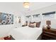 Bright bedroom with a large window, light wood floors and chic furnishings at 3540 Pecos St, Denver, CO 80211