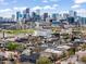 Wonderful skyline view from this neighborhood showcasing lovely homes with lush mature trees at 3540 Pecos St, Denver, CO 80211